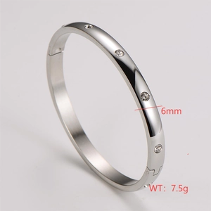 Detail shot of 6mm wide silver stainless steel bangle with inlaid crystals and polished finish