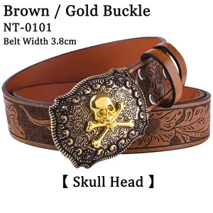 Detail of western belt featuring golden skull buckle with intricate embossed patterns