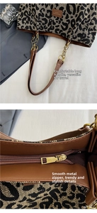Detail view of leopard print tote bag with brown straps and smooth metal zipper closure