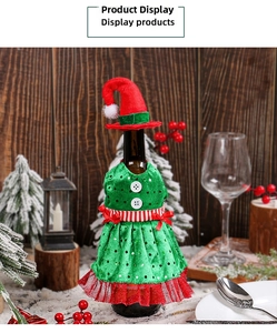 Detail of Christmas elf wine bottle dress with green sequins, red tulle, and a mini hat