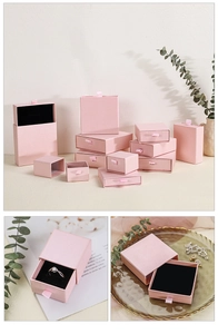 Pink drawer jewelry box with ribbon handle and protective foam insert for rings
