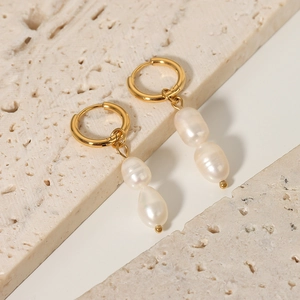Vintage Baroque freshwater pearl earrings with gold titanium steel hoops on stone base