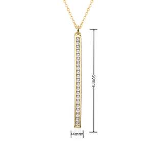 Detail shot of vertical gold bar pendant necklace measuring 50mm height with square zircons