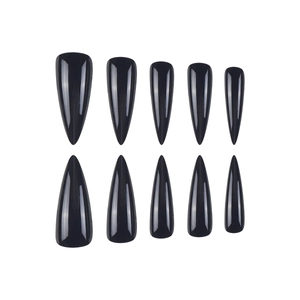 Detail view of ten glossy black almond-shaped press-on nails arranged on a white background