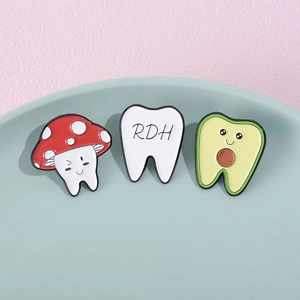 Cartoon tooth enamel pin set with mushroom, avocado, and RDH letter designs