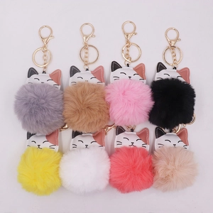 Set of 8 cute cartoon cat plush pompom keychains in assorted colors with gold hardware