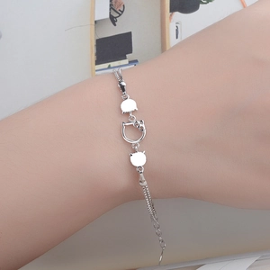 Silver Hello Kitty double-chain bracelet with cute cat charms and adjustable clasp