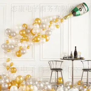 Champagne bottle balloon arch kit with gold, silver, and white latex balloons for parties