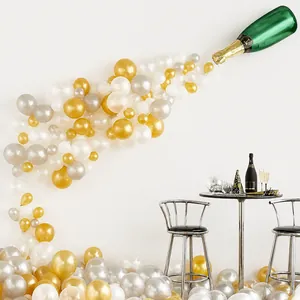 Champagne bottle balloon arch kit with gold, silver, and white latex balloons for parties