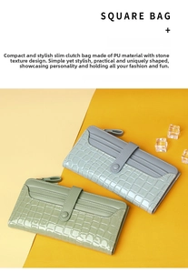 Detail view of long wallets in mint and blue with croc-embossed texture and snap closure