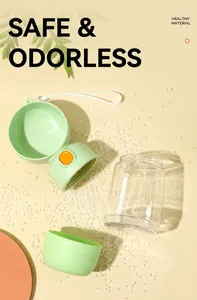 Disassembled view of portable pet water bottle showing green scoop and clear storage tank