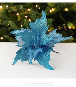 Sparkling blue Christmas poinsettia flower with glitter finish and berry center detail