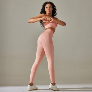 Close-up of pink seamless yoga set showing breathable knit texture and push-up leggings