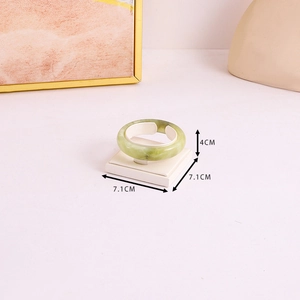Detail showing dimension of green jade texture jewelry display stand on white base