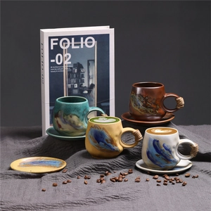 Artistic detail of four retro ceramic coffee cups with hand-painted glaze and hemp rope handles