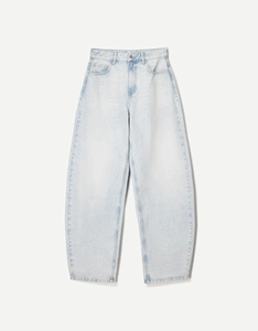 Detail of high waisted wide leg jeans in light blue denim with balloon fit silhouette