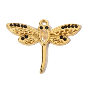 Detail of golden dragonfly pendant with clear teardrop gemstone and black accents