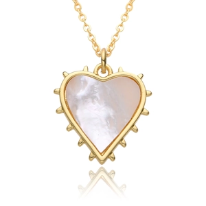 Close-up of heart-shaped white mother of pearl pendant with gold spiked edge detail