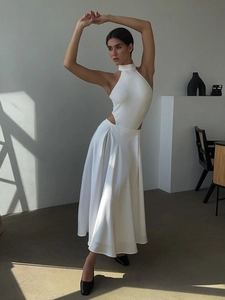 Elegant white knit halter top and high-waisted satin maxi skirt set for a minimalist look