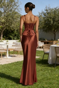 Rear view of brown satin two-piece set showing lace-up back detail and maxi skirt