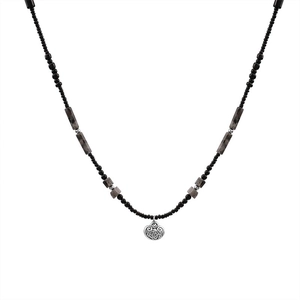Bamboo style beaded necklace with black marble beads and a silver vintage lock pendant