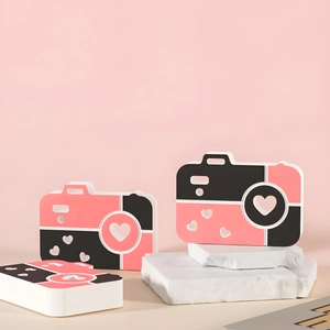 Pink heart-patterned camera silicone mold for DIY resin crafts on marble display