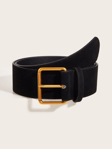 Detail of vintage black suede belt featuring a polished gold-tone square metal buckle