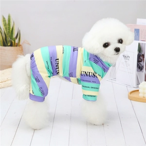 Detail of colorful striped dog pajamas showing the breathable knit fabric and cuff design