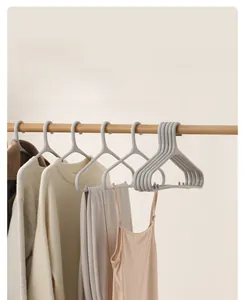 Detail of light grey non-slip plastic hangers with hooks for camisoles and sweaters