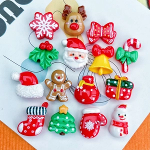 Flat lay of 15 festive Christmas resin charms including Santa, snowman and reindeer