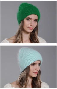 Detailed texture of chunky cable knit angora wool hat with soft fluffy ribbed cuff