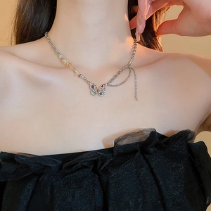Elegant stainless steel chain necklace with colorful rhinestone butterfly pendant on model