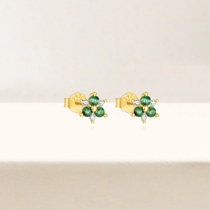 Close-up of S925 hallmark on gold plated sterling silver emerald flower stud earrings