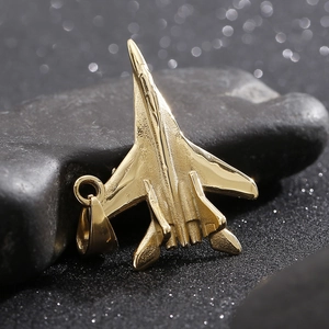 Polished gold titanium fighter jet pendant necklace on dark stone, punk style for men