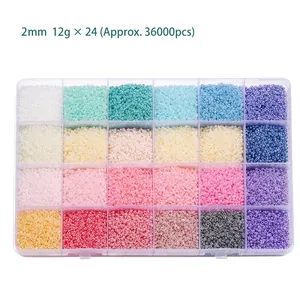Detailed view of 24-color 2mm glass seed beads set in a transparent storage organizer box