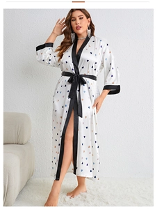 Detail of white satin robe with heart print, contrast black piping and belted waist tie