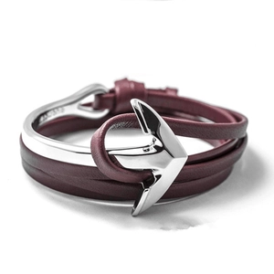 Close-up of deep red multilayer leather bracelet with a silver anchor metal clasp