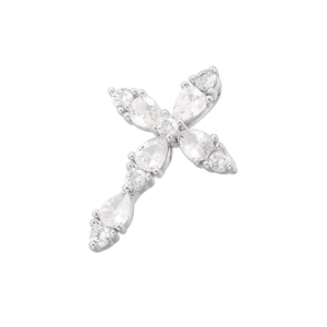 Close-up of silver-plated cross pendant with pear and round-cut sparkling clear gemstones