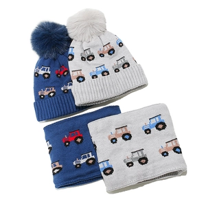 Kids winter knit hat and scarf set with colorful tractor patterns and faux fur pompom