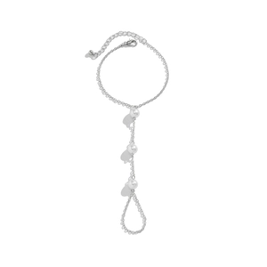 Detail of silver chain hand harness with white faux pearls and rhinestone finger ring link