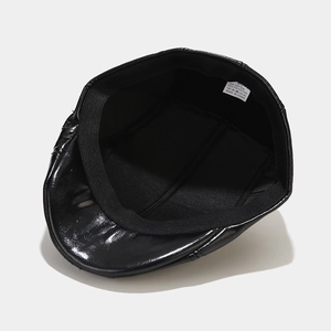 Interior view of black PU leather beret showing elastic sweatband and inner lining