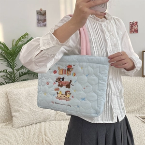 Quilted light blue tote bag featuring cute cartoon embroidery and pink handles