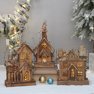 Cozy wooden Christmas village houses with warm LED lights and glitter accents