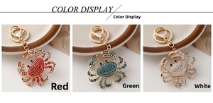 Detailed color display of ocean crab keychains with sparkling rhinestones in three colors