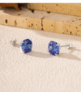Macro shot of S925 sterling silver stud earrings with royal blue octagon cut diamonds