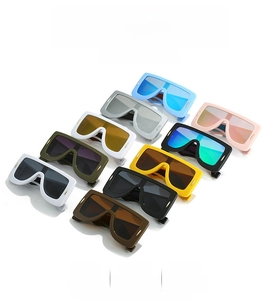 Flat lay of retro oversized square sunglasses in ten colorful resin frame variations