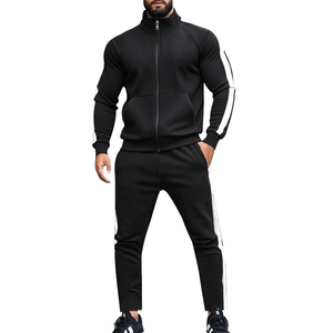 Front view of black tracksuit jacket and pants featuring side white stripe details