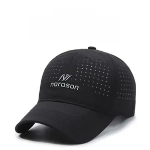 Detail of laser-cut breathable holes and silver narason logo on black quick-dry baseball cap
