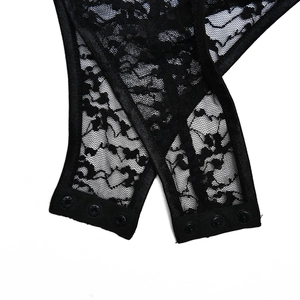 Close-up of the snap button closure and lace texture on black bodysuit underwear