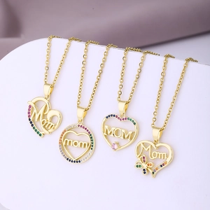 Macro detail of gold-plated MOM necklaces with heart charms and colorful zircons